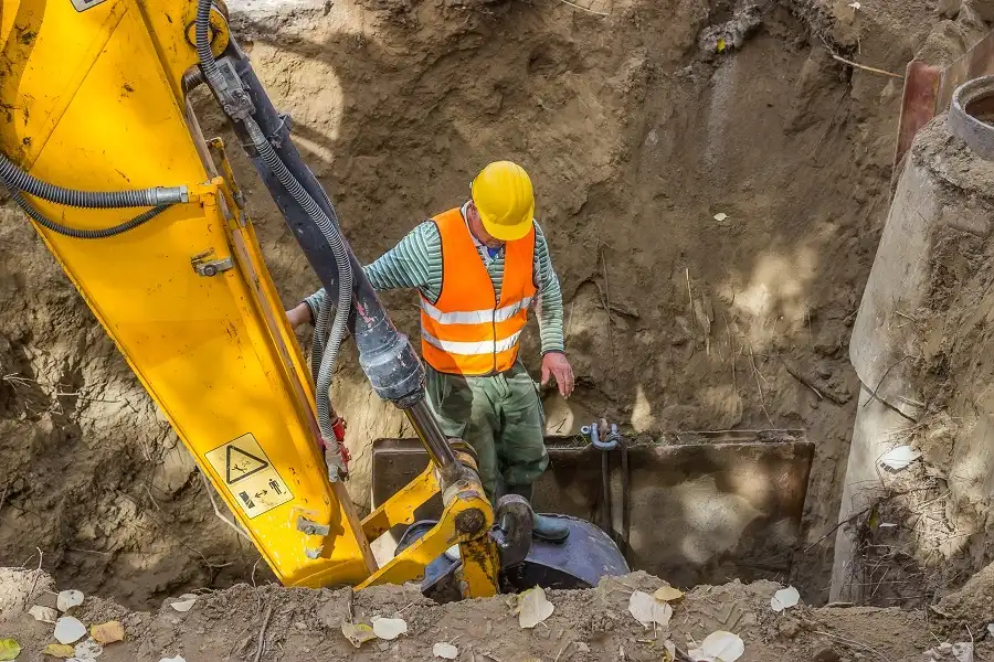 construction worker in trench